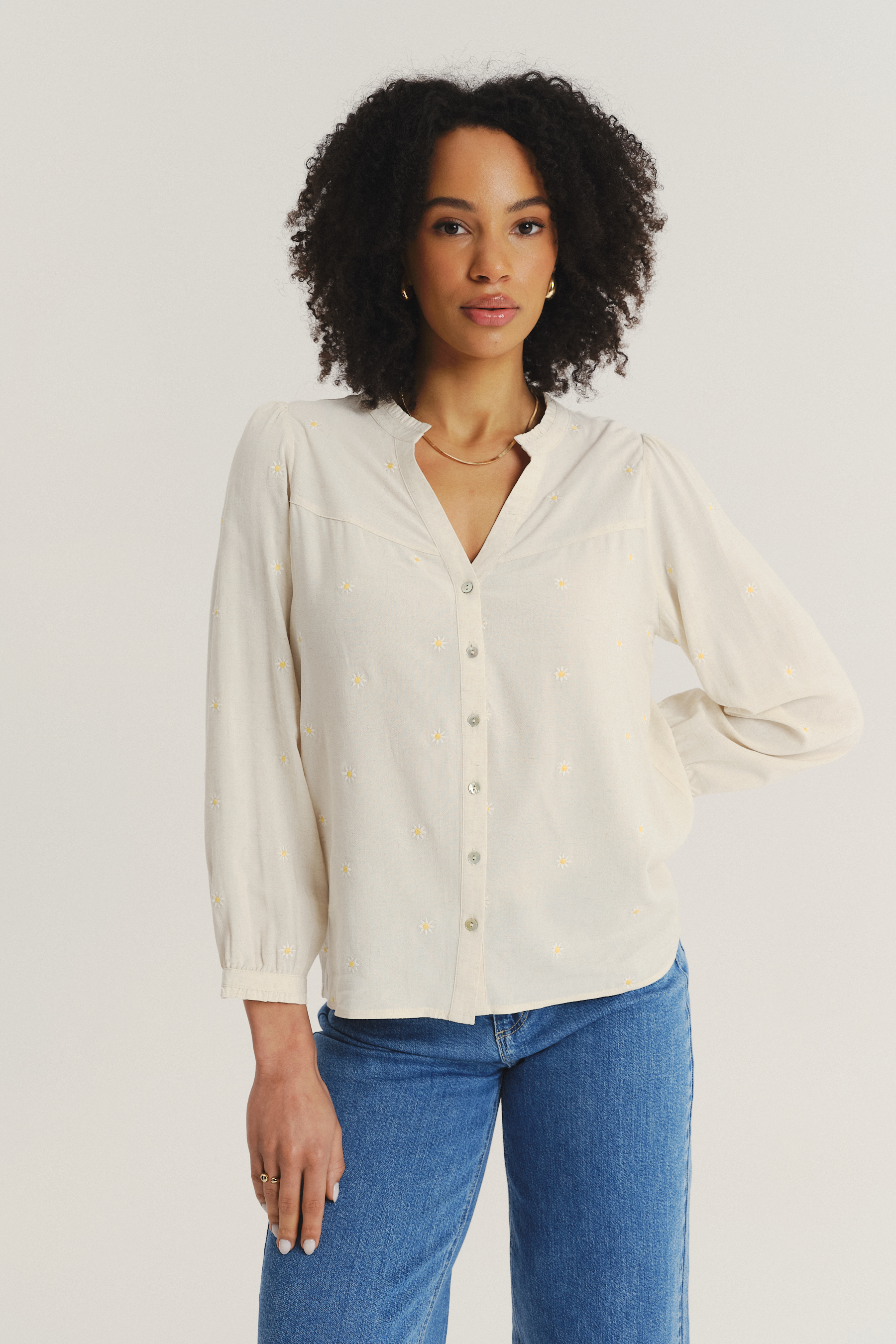 Subtelna kremowa bluzka z riuszką