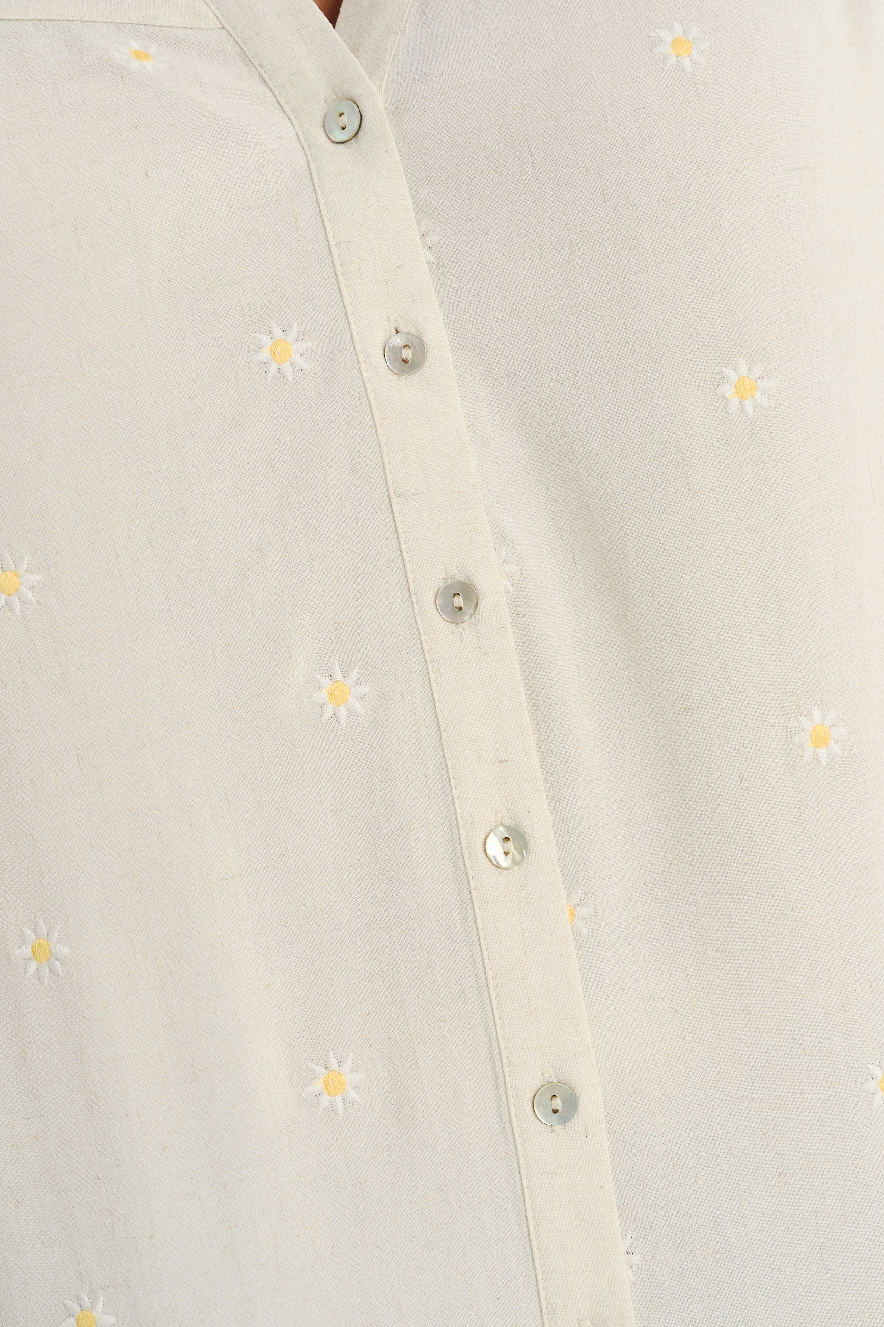 Subtelna kremowa bluzka z riuszką