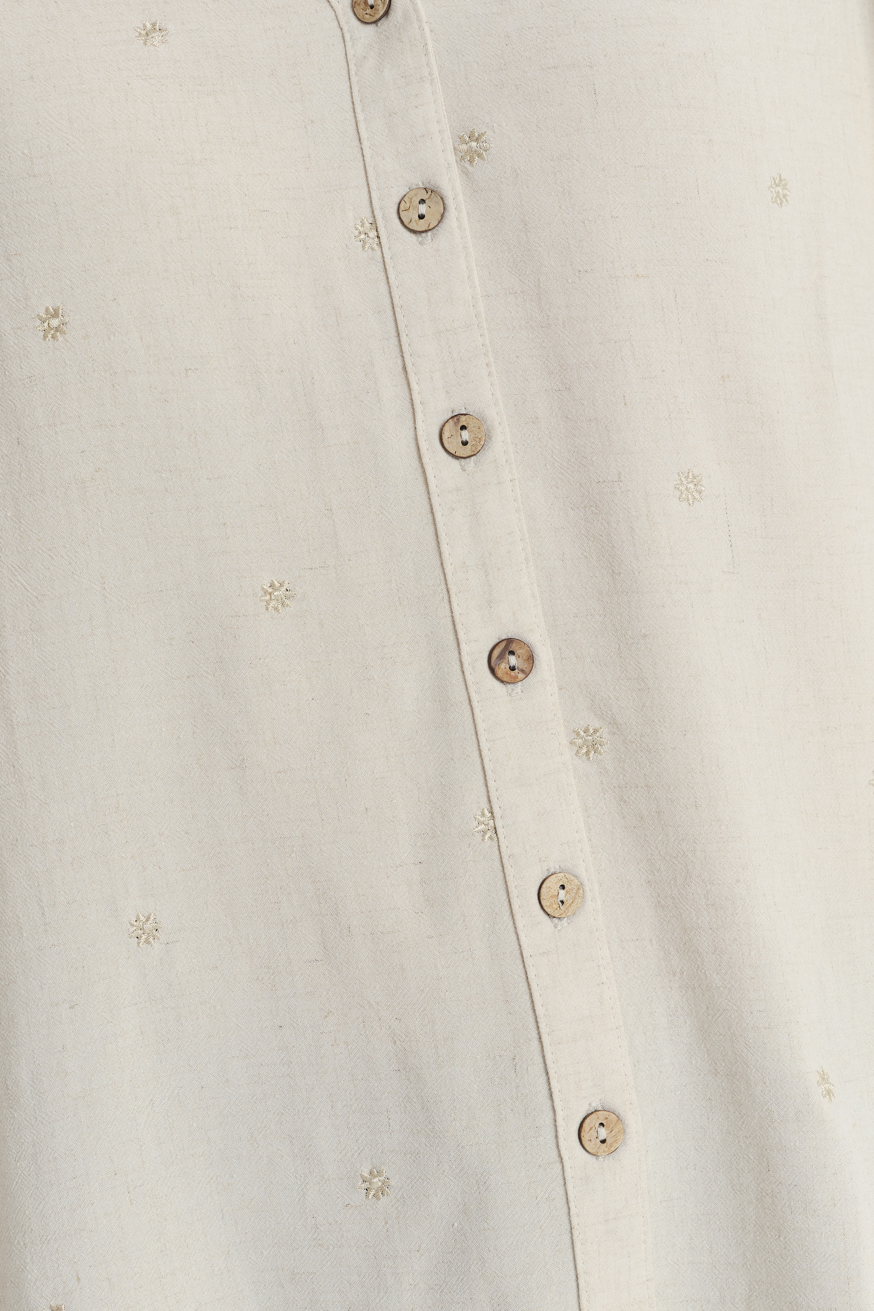 Jasnobeżowa bluzka z rękawami typu motylki