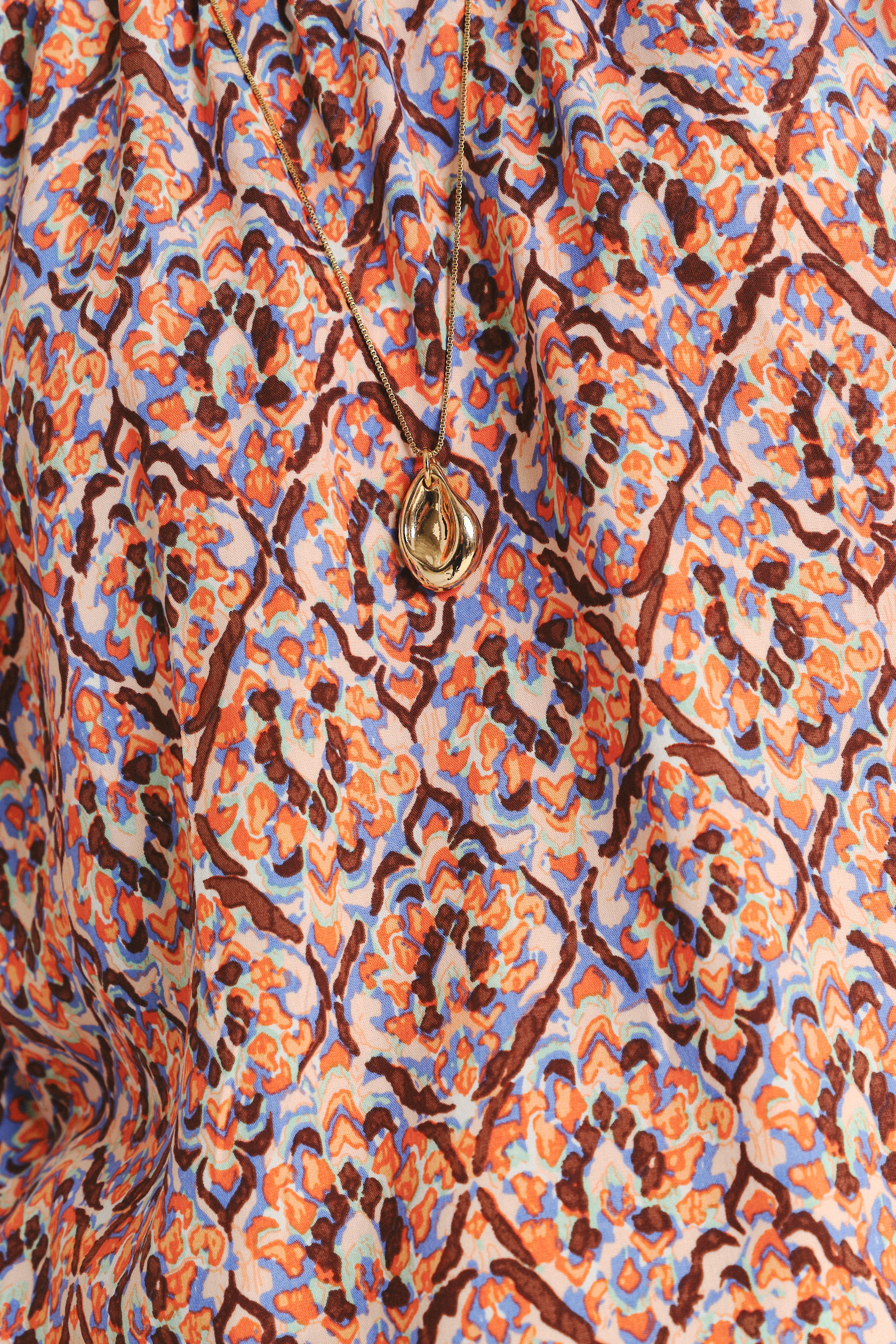 Luźna bluzka z kolorowym nadrukiem etno