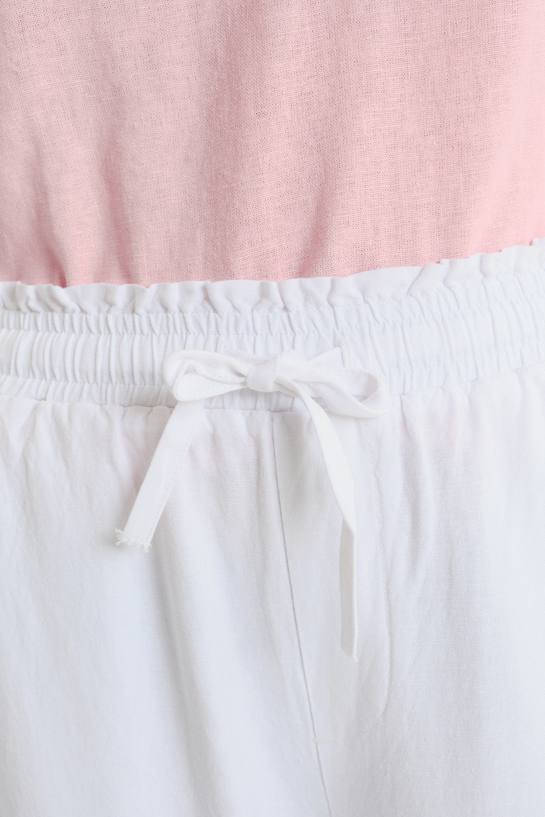 Lniano-wiskozowe spodnie z troczkami u dołu nogawek