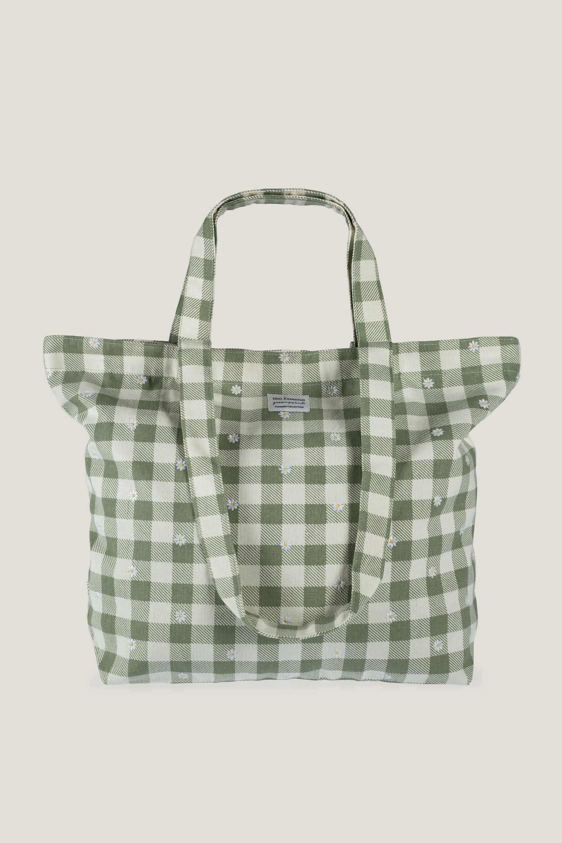 Kremowo-zielona torba z nadrukiem w stokrotki