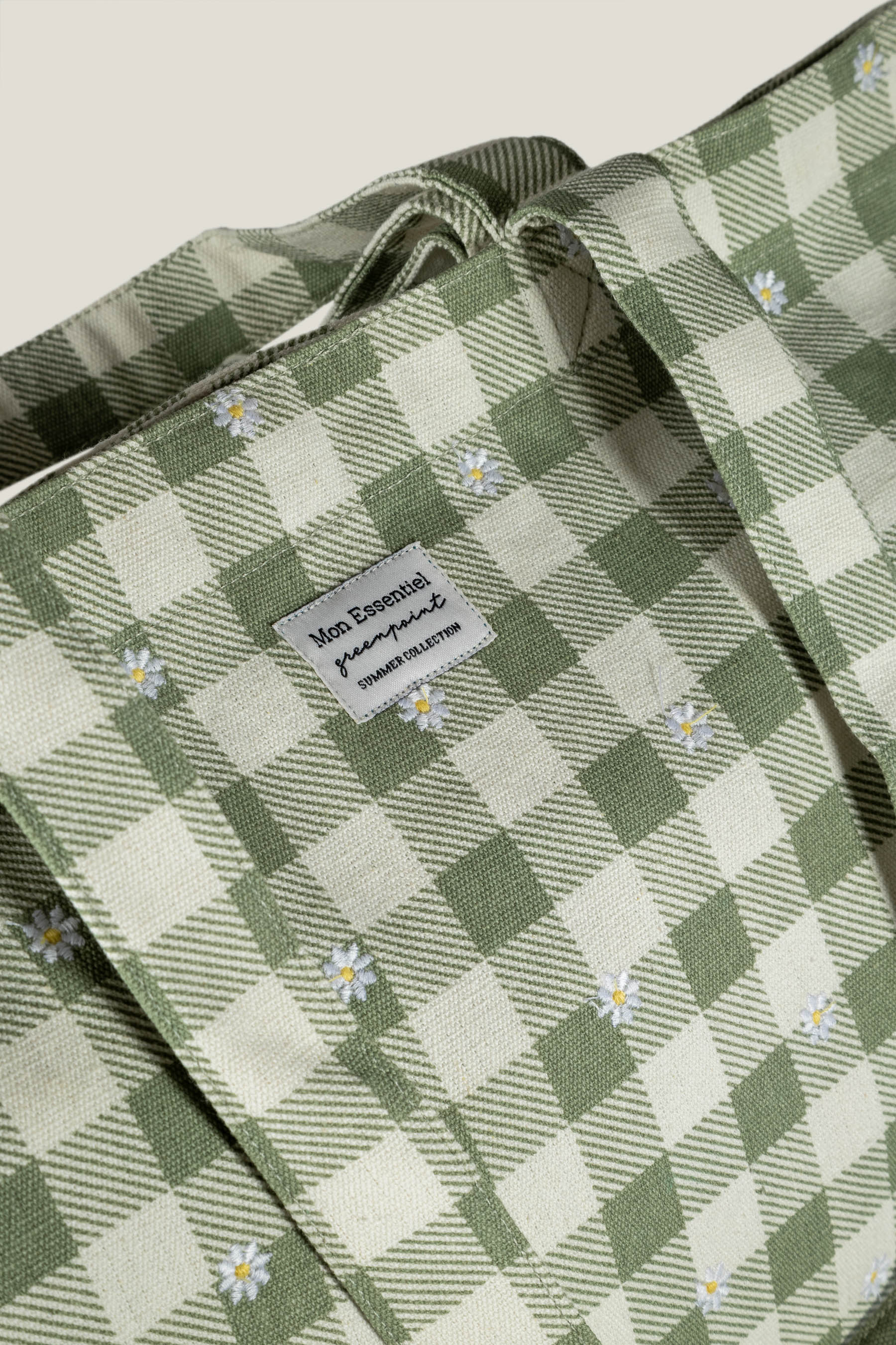 Kremowo-zielona torba z nadrukiem w stokrotki