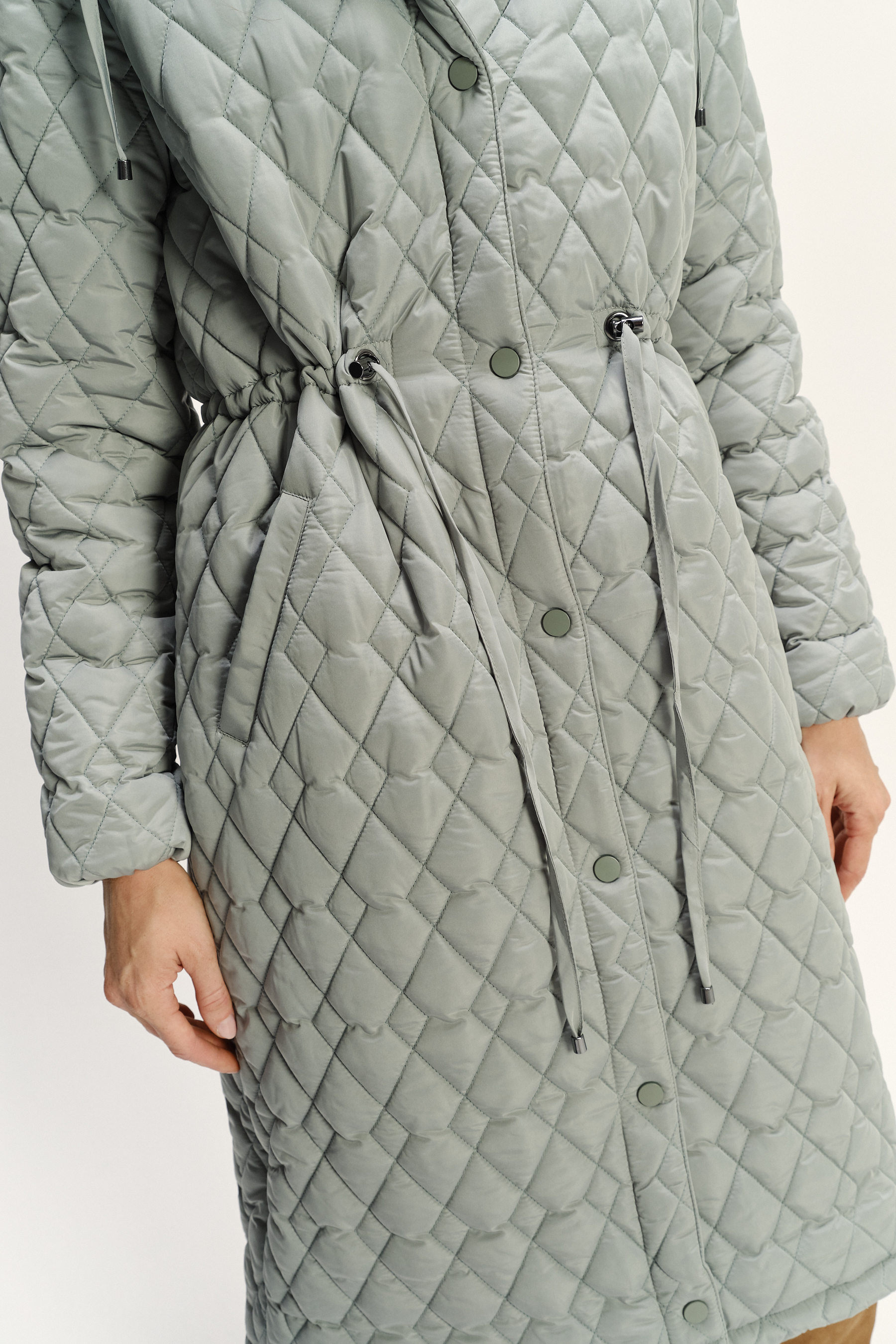 Pikowana jasnozielona kurtka z kapturem