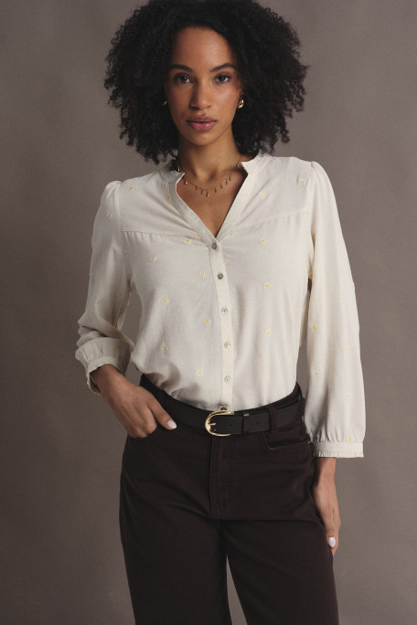 Subtelna kremowa bluzka z riuszką