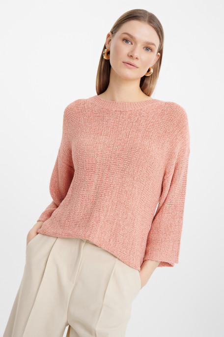 Brzoskwiniowy sweter z szerokimi rękawami