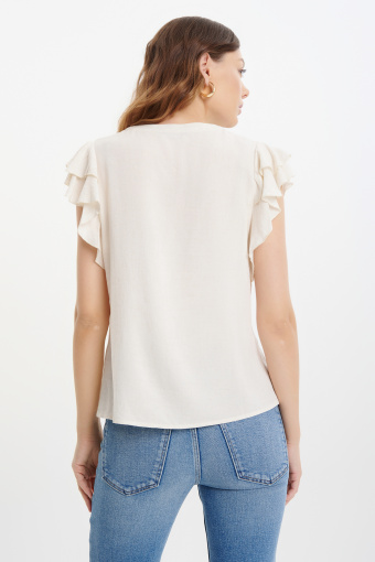 Kremowa bluzka z rękawami typu motylki