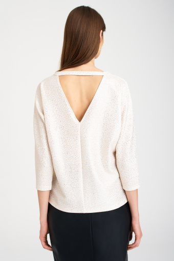 Kremowa bluza z błyskiem i wycięciem na plecach Kremowa bluza z błyskiem i wycięciem na plecach