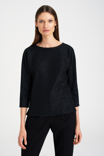 Czarna, połyskująca bluza z odkrytymi plecami