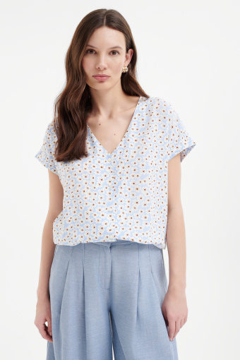 Luźna bluzka w kwiaty z wiązaniem u dołu