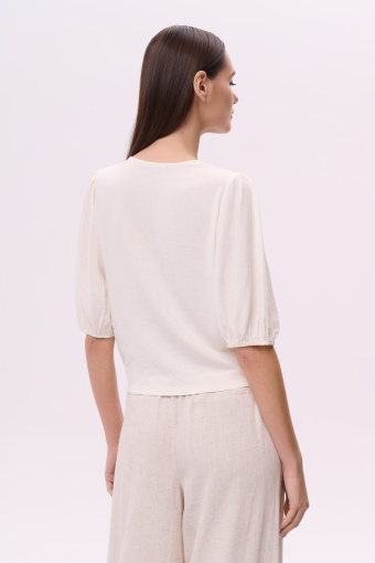 Jasnobeżowa klasyczna bluzka z wiązaniem u dołu Jasnobeżowa klasyczna bluzka z wiązaniem u dołu