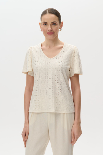Kremowy top o ażurowej strukturze