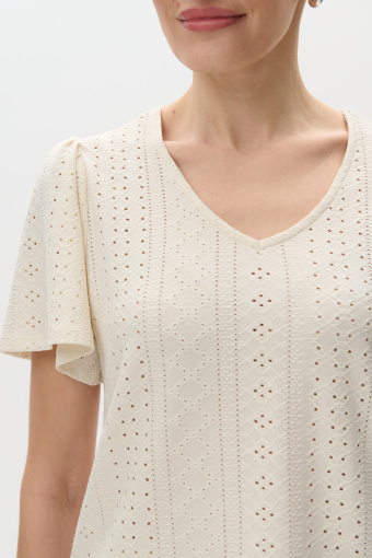 Kremowy top o ażurowej strukturze