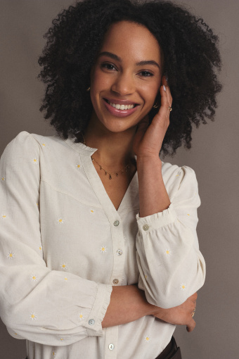 Subtelna kremowa bluzka z riuszką