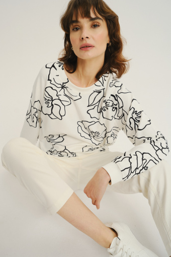 Kremowa bluza z artystycznym kwiatowym motywem