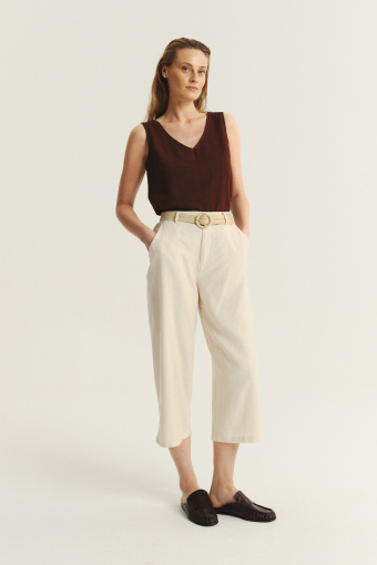 Kremowe spodnie kuloty z plecionym paskiem