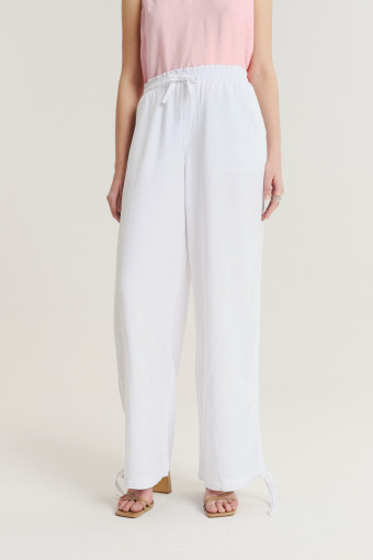 Lniano-wiskozowe spodnie z troczkami u dołu nogawek