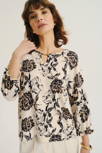 Kremowy top z nadrukiem w kwiaty