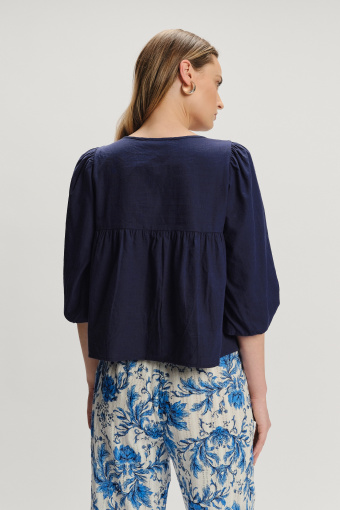 Granatowa bluzka z wiązaniem przy dekolcie