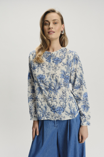 Elegancka bluzka w kwiaty z podkreśloną talią Elegancka bluzka w kwiaty z podkreśloną talią