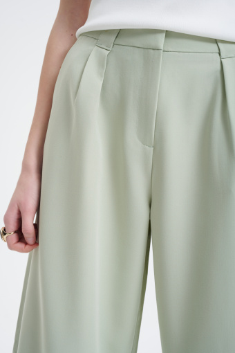 Eleganckie spodnie z szeroką nogawką w kolorze miętowym  Eleganckie spodnie z szeroką nogawką w kolorze miętowym