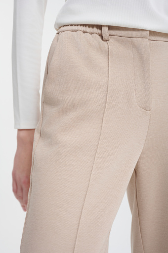 Beżowe spodnie z szeroką nogawką 
