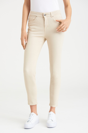 Bawełniane spodnie typu slim, kremowe