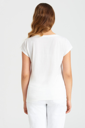 Luźny, biały top z grafiką w kwiaty