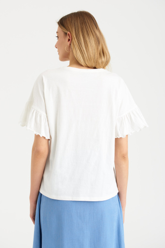 Biała bluzka z kolorowymi haftami Biała bluzka z kolorowymi haftami