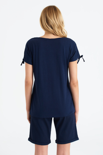 Top z troczkami na ramionach