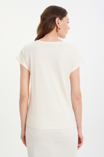 Kremowy top z niebieską grafiką Kremowy top z niebieską grafiką