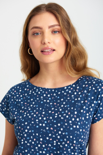 Granatowy top z gumką u dołu, nadruk w kropki