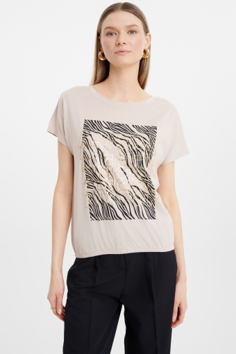 Jasnobeżowy top z grafiką  