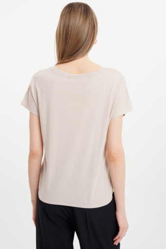 Jasnobeżowy top z grafiką  