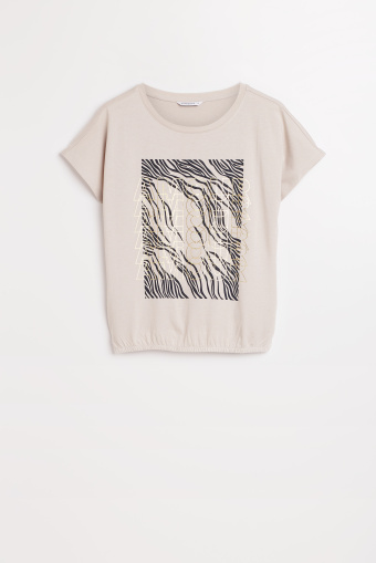 Jasnobeżowy top z grafiką  