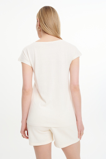 Kremowy top z grafiką