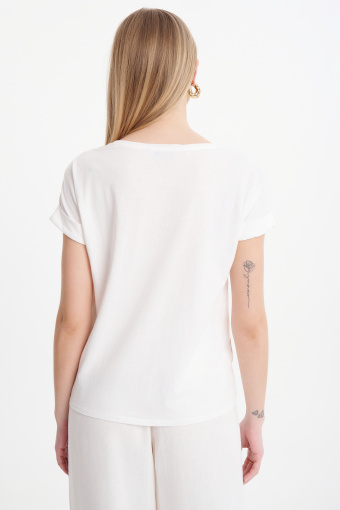 Biały top z metaliczną roślinną grafiką Biały top z metaliczną roślinną grafiką