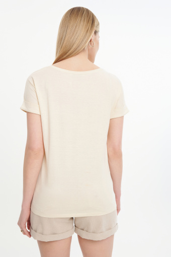 Beżowy top z roślinną grafiką