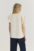 Jasnobeżowa bluzka z rękawami typu motylki