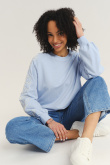 Bluza z kwiatami na rękawach kolor baby blue