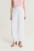 Lniano-wiskozowe spodnie z troczkami u dołu nogawek