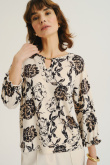 Kremowy top z nadrukiem w kwiaty