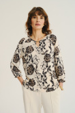 Kremowy top z nadrukiem w kwiaty
