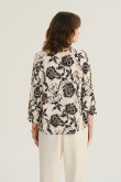 Kremowy top z nadrukiem w kwiaty