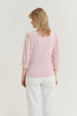 Jasnoróżowy top z efektownymi rękawami