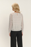 Biała bluzka z zapięciem typu łezka nadruk w kropki