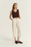 Kremowe spodnie kuloty z plecionym paskiem